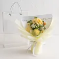 Handmade crochet bouquet with yellow carnations and roses in a transparent gift bag - Carnation Mix - Yellow Series