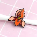 Detailed macro view of an artistic uterus flower enamel pin with vibrant orange and red colors - Human Organ Flower Combo Style(XZ0484)