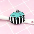 Detailed view of Halloween pumpkin enamel pin with black and white stripes on pink backdrop - Striped Melting Pumpkin (XZ0277)