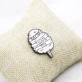 Close-up of pink cotton candy enamel pin with Sweeter Than You text on fabric cushion - Pink Marshmallow Style (XZ0977)