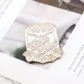 Book Lover enamel pin with gold metal frame and green leaves on a book background - Book Style (MZ005)