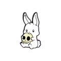 Cute cartoon white bunny holding a yellow skull enamel pin with dark humor aesthetic - Rabbit Holding Skull (WY0156)