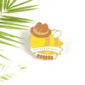 Macro detail of enamel bee pin wearing a cowboy hat with Beehaw text and gold plating - Cowboy Bee (WY1300)