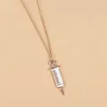 Detailed view of creative golden syringe pendant necklace with white enamel medical scale - White Syringe Style (XL729)