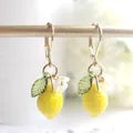 Fresh lemon floral drop earrings with yellow fruit, green leaves, and gold lever-back hooks - Lever-back Lemon Dangle Earrings