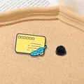 Detail of yellow enamel envelope pin with quill pen on textured cork background - Yellow Envelope Style (CZ0136)
