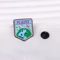 Detail view of cartoon enamel planet brooch with smiley face, stars and butterfly clutch - Shield Shape Earth Style (CZ0406-1)