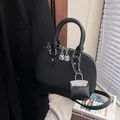 Black shell-shaped tote bag in quilted leather with a mini bag charm accessory - Without Pendant / Black