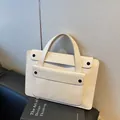 Minimalist beige waterproof leather tote bag for business commuting with black studs - Off White