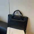Minimalist black waterproof business tote bag in smooth leather finish for women - Black