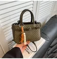 Retro dark green crossbody handbag with checkerboard embossing and beaded tassel charm - Green