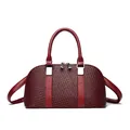 Minimalist woven texture handbag in deep wine red with silver hardware and shoulder strap - Burgundy