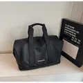 Große schwarze Reisetasche mit separatem Schuhfach und robusten Tragegriffen - Schwarz