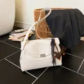 Beige pebble leather briefcase with dachshund charm and silver rotary lock closure - White With Pendant / White