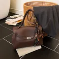 Dark brown pebble leather briefcase with dog charm and silver twist lock closure - Coffee with Pendant / Brown