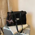 Retro black lychee leather briefcase with silver turn-lock and dachshund charm - Black With Rabbit Pendant / Black
