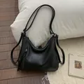 Classic black faux leather tote bag with functional zippers and twin shoulder straps - Black With Pendant