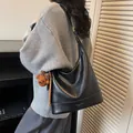 Black leather hobo shoulder bag with white contrast stitching and a cute bear charm - With Pendant / Black
