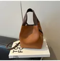 Two-tone caramel bucket bag in pebbled leather with dark brown handle and strap - No Pendant / Brown