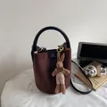 Chic caramel brown suede bucket bag with black leather handle and cute rabbit charm - No Pendant / Brown