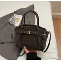 Dark brown suede handbag with white contrast stitching and elegant buckle detail - Coffee