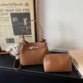 Brown litchi leather bucket bag set with silver twist lock and plush rabbit charm - With Pendant / Brown