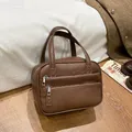 Brown lychee leather briefcase with double front zippers and top handles in caramel tone - No Chain / Brown
