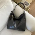 Deep gray glossy tote bag with vintage beaded charm and metallic ring detail - Black - With Pendant