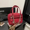 Large burgundy leather briefcase with pebbled texture and stylish metal chain charm - No Chain / Red