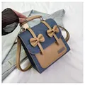 Mochila estilo británico en denim azul y cuero marrón con lazos decorativos - Azul oscuro