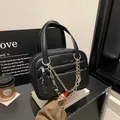 Classic black pebble leather briefcase featuring gold-silver chain and heart charm - No Chain / Black