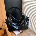 Large black hobo bag in glossy wrinkled leather with silver stud shoulder strap - Black
