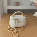 White diamond quilted mini bag with gold circular handle and floral emblem crossbody - White Large