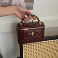Quilted burgundy patent leather mini vanity bag with golden camellia and handle - Red Large
