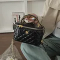 Chic black quilted box bag with golden camellia hardware and chain strap details - Black Large