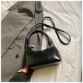 Glossy black crescent shoulder bag in premium leather finish with adjustable strap - Black without Pendant