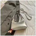 Metallic silver hobo bag for women with a sleek crescent moon shape and adjustable strap - Silver No Pendant
