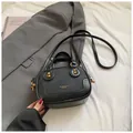Minimalist black lychee texture crossbody bag with gold hardware and dual handles - Black without Pendant