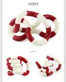 Close-up of red and white twistable fidget sensory toy showing flexible rotating joints - Wacky Rope Red White