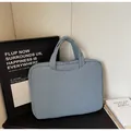 Light blue quilted laptop sleeve with minimalist padded design and zipper closure - Blue