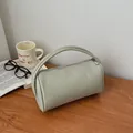 Chic light green cylinder handbag with litchi grain leather and silver zipper - Green