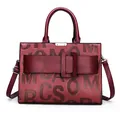 Burgundy faux leather tote bag with embossed letters and large buckle decoration - Single Bag / Burgundy