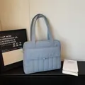 Minimalist light blue quilted tote bag for commute featuring soft padded nylon fabric - Blue