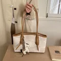 Beige canvas tote bag with geometric texture, brown leather trim and horse charm - White & Khaki