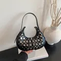 Fashionable black hobo underarm bag with silver rivet details and a stylish half-moon shape - Black