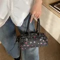 Deep grey denim pillow bag with floral rose print and silver buckle straps style - Black