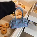 Blue denim Boston bag with red floral print and slim handles for casual daily style - Blue