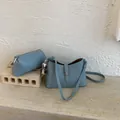 Light blue faux leather crossbody bag with small triangle pouch and pompom charm - With Pendant / Blue