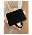 Minimalist black quilted laptop tote bag with padded handles and thick protective texture - Black