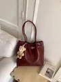 Deep burgundy tote bag with leather strap buckle and a cute bear plush keychain charm - With Charm / Red